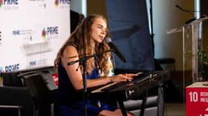 Abby Litchfield playing the piano and singing an original song at PRME